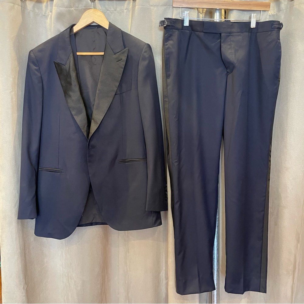 3 piece navy blue Suit Supply tailored suit.
